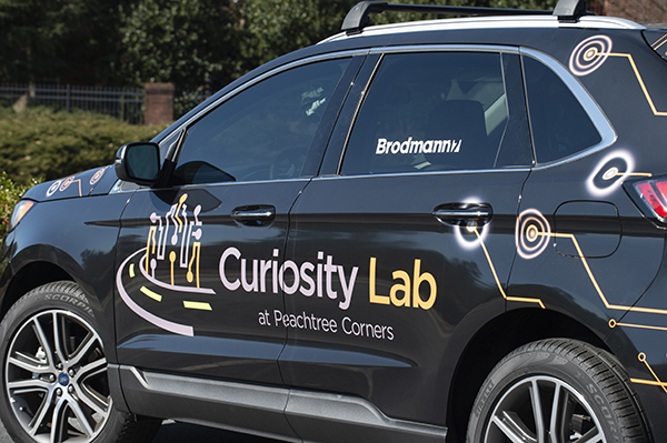 Curiosity Lab vehicle with logo.