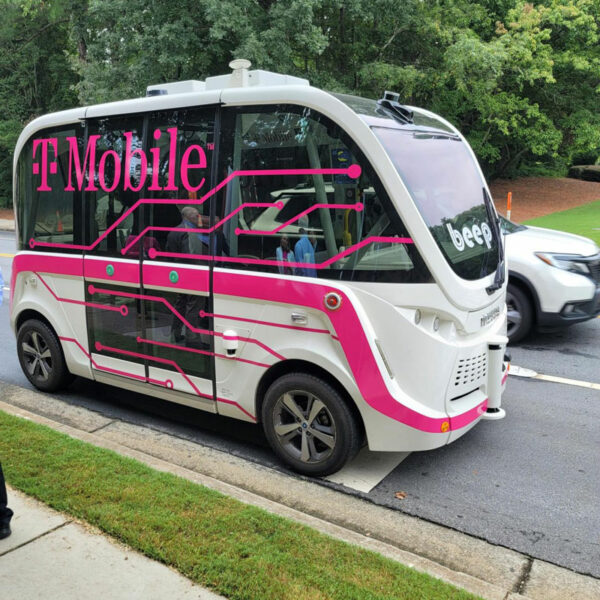 An autonomous vehicle wrapped with T-Mobile