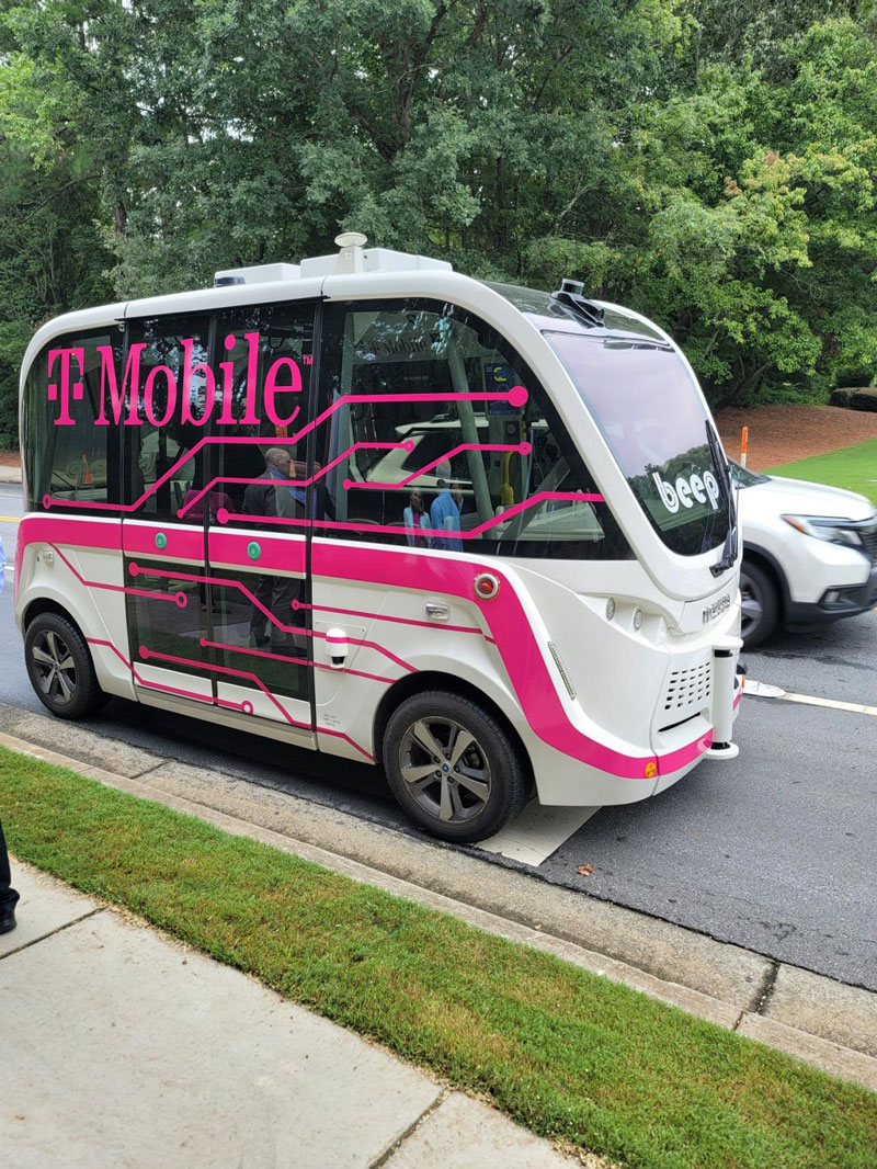 An autonomous vehicle wrapped with T-Mobile