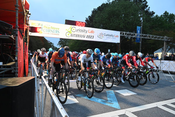 Cyclists at the starting line of the Curiosity Lab Criterium.